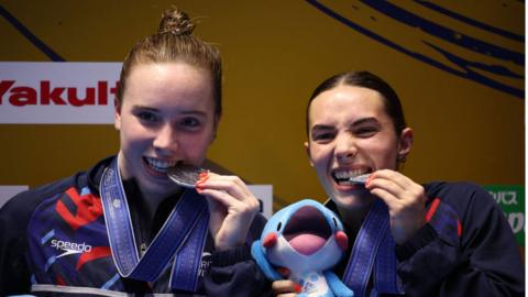 Scarlett Mew Jensen and Yasmin Harper celebrate with their silver medals
