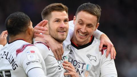 James Collins celebrates scoring a goal for Derby with team-mates