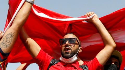 Supporters of Tunisia's president near the capital's parliament building, 26 July 2021