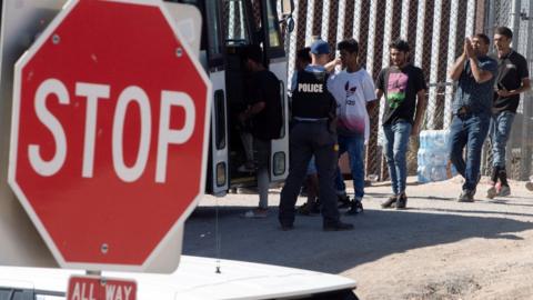 Migrants are loaded onto buses for the Customs and Border patrol agency along the southern border of the US and Mexico