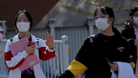 Students wearing face masks leave a school in Beijing, China as senior high school students in the Chinese capital returned to campus following the coronavirus disease (COVID-19) outbreak, April 27, 2020.