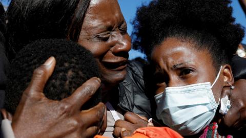 People react outside the Glynn County Courthouse after the jury reached a guilty verdict in the trial of William "Roddie" Bryan, Travis McMichael and Gregory McMichael, in Brunswick, Georgia, US, 24 November 2021