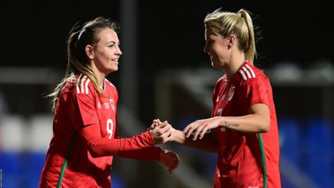 Wales duo Kayleigh Green and Gemma Evans celebrate Green's penalty