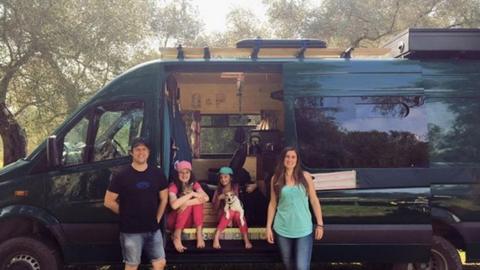 The Thacker family in the olive grove with their van