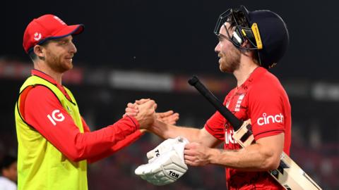 Phil Salt shakes hands with Jos Buttler