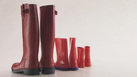 Three pairs of red boots