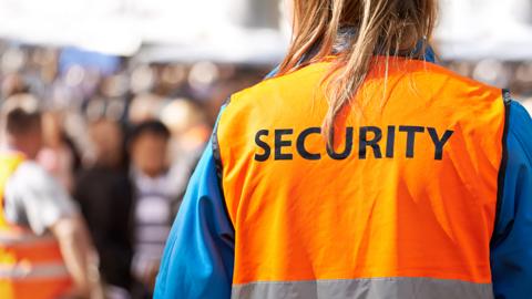 Person in reflective security vest