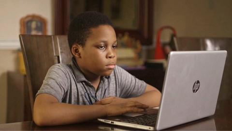 A child studying using the Gradely e-learning platform