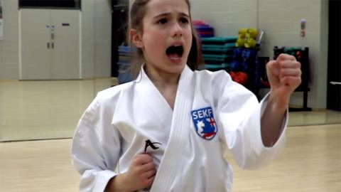 Carla competes in karate