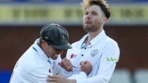 Wayne Madsen helped Derbyshire's Matt Critchley celebrate only his third five-wicket haul for the county