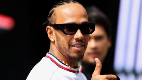 Lewis Hamilton gives a thumbs up at Silverstone