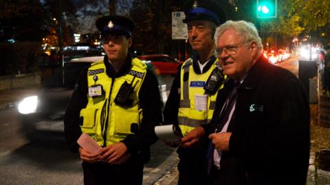 Sir Graham Bright with Cambs Police officers