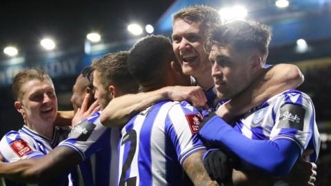 Josh Windass of Sheffield Wednesday celebrates with teammates after scoring his side's first goal during the Emirates FA Cup Third Round match between Sheffield Wednesday and Newcastle United at Hillsborough on January 07, 2023 in Sheffield