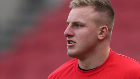 James Dun during a pre-match warm-up for Bristol