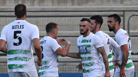 Saints players celebrate Rory Holden's goal