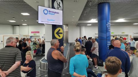 passengers at Birmingham Airport