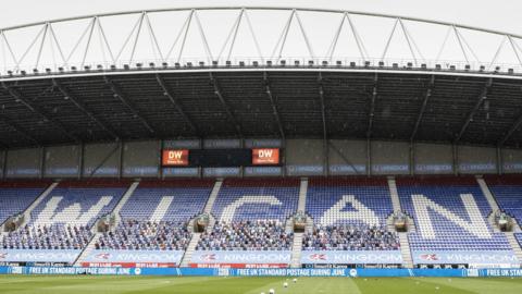 Stand at Wigan's ground with the word Wigan spelled out on seats