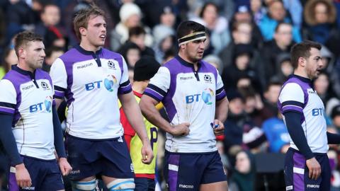 Scotland players wait under their own posts after conceding a try against France