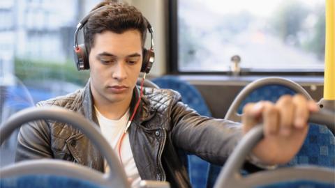 young person on a bus