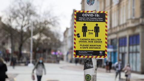 A sign with Covid restrictions in Cardiff's city centre during lcokdown