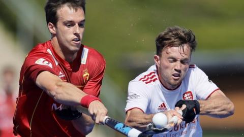 Spain's Marc Miralles challenges England's Zach Wallace at the 2023 EuroHockey Championships