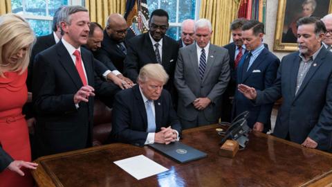 President Trump with faith leaders in the Oval Office