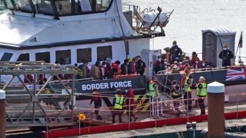 Migrants step ashore at Dover, Kent