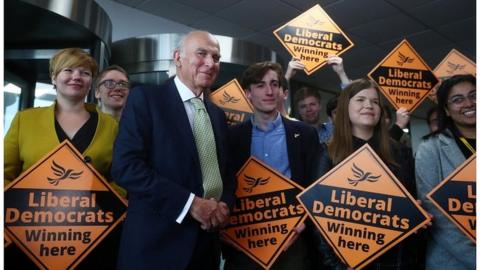 Sir Vince Cable with Lib Dem activists