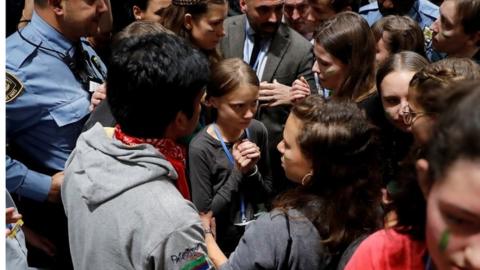 Swedish environmental activist Greta Thunberg (C) and some teenagers from the Fridays for Future movement arrive to attend the fifth day of the UN Climate Change Conference COP25 in Madrid, Spain, 06 December 2019.