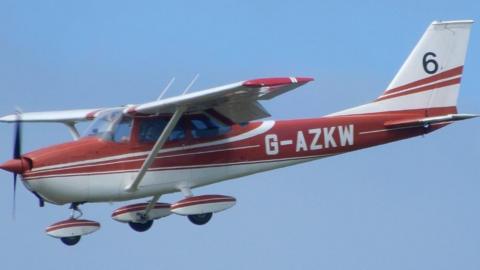 Light aircraft flying above Guernsey