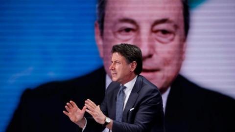Italian president of the 5 Star Movement Giuseppe Conte guest at the television program Porta a Porta. In the background Mario Draghi. Rome (Italy), May 11th, 2022