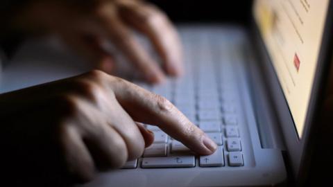 A file photo of a woman using a laptop