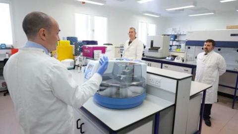 Ministers Edwin Poots and Robin Swann at the launch of the testing centre on 14 April