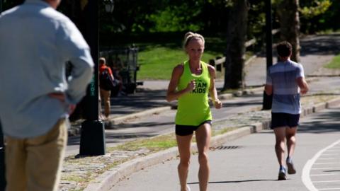Female runner in yellow top in Central Park