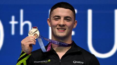 Ireland's Rhys McClenaghan poses with his gold medal after winning the European pommel horse title in Antalya