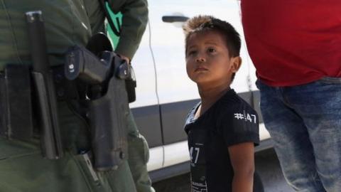 A migrant child from Honduras is detained by US border patrol