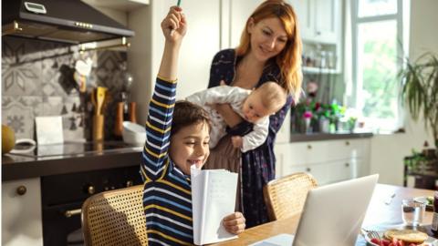 new mum with baby and son