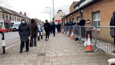 Queues for the vaccination centre at Cardiff and Vale Therapy Centre in Splott