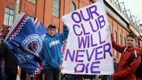 Rangers fans protest against former owner Craig Whyte and show their support for Rangers outside Ibrox Stadium prior to the Scottish Premier League football match between Rangers and Kilmarnock at Ibrox Stadium in Glasgow, Scotland on February 18, 2012.