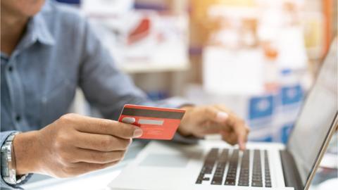 Man paying online with card