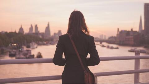 Woman on Thames bridge