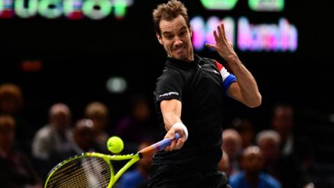 Richard Gasquet hitting a tennis ball