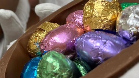 Easter eggs in pink, purple and gold foil wrapping