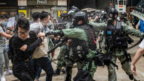 Police pepper spray protesters in Hong Kong