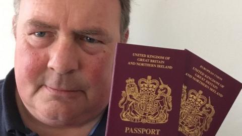 Peter Brady and his partner's new passports