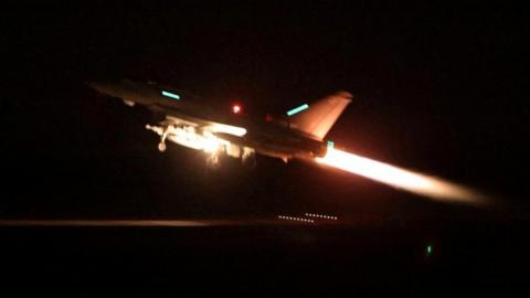 An RAF Typhoon aircraft takes off at night ahead of strikes on Houthi positions in Yemen