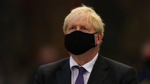 Boris Johnson wearing a face mask