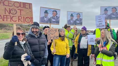 Placard-waving protesters