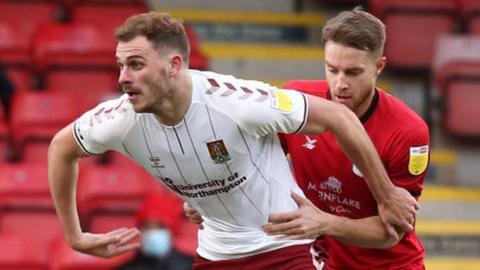 Harry Smith (left) in action for Northampton Town