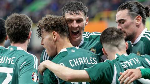 Eoin Toal celebrates with Dion Charles